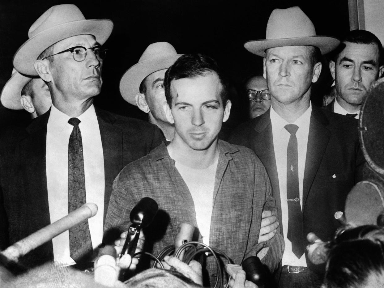 <p>US President John F Kennedy’s murderer Lee Harvey Oswald during a press conference after his arrest in Dallas</p> (AFP via Getty Images)