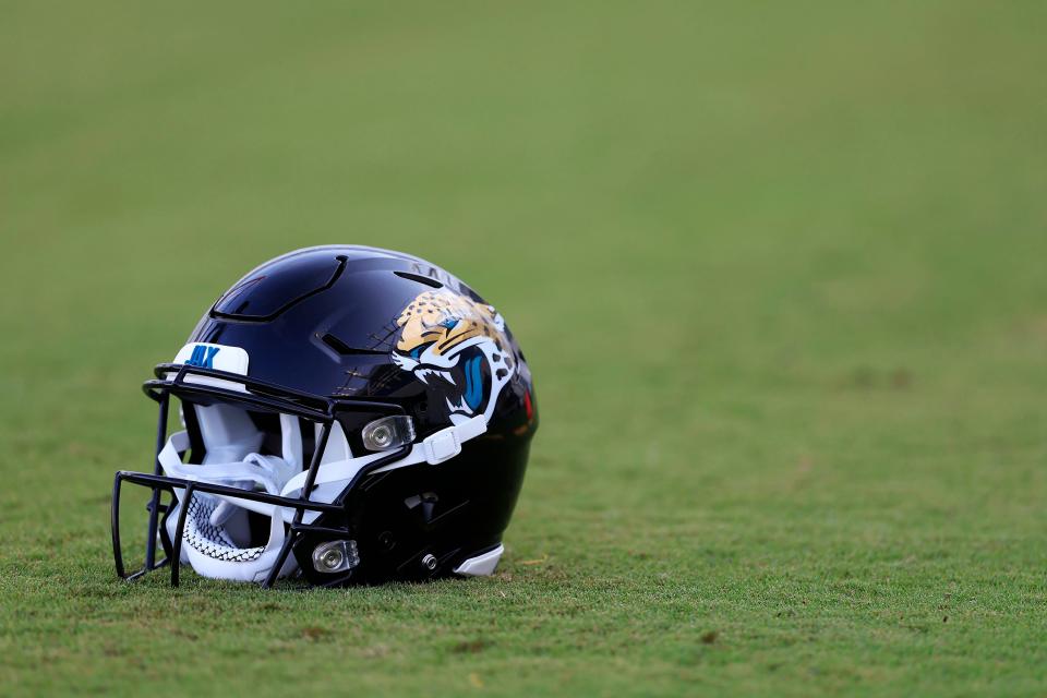 A Jacksonville Jaguars helmet lies on the turf Wednesday, July 26, 2023 at Miller Electric Center at EverBank Stadium in Jacksonville, Fla. Today marked the first day of training camp for the Jacksonville Jaguars. 
