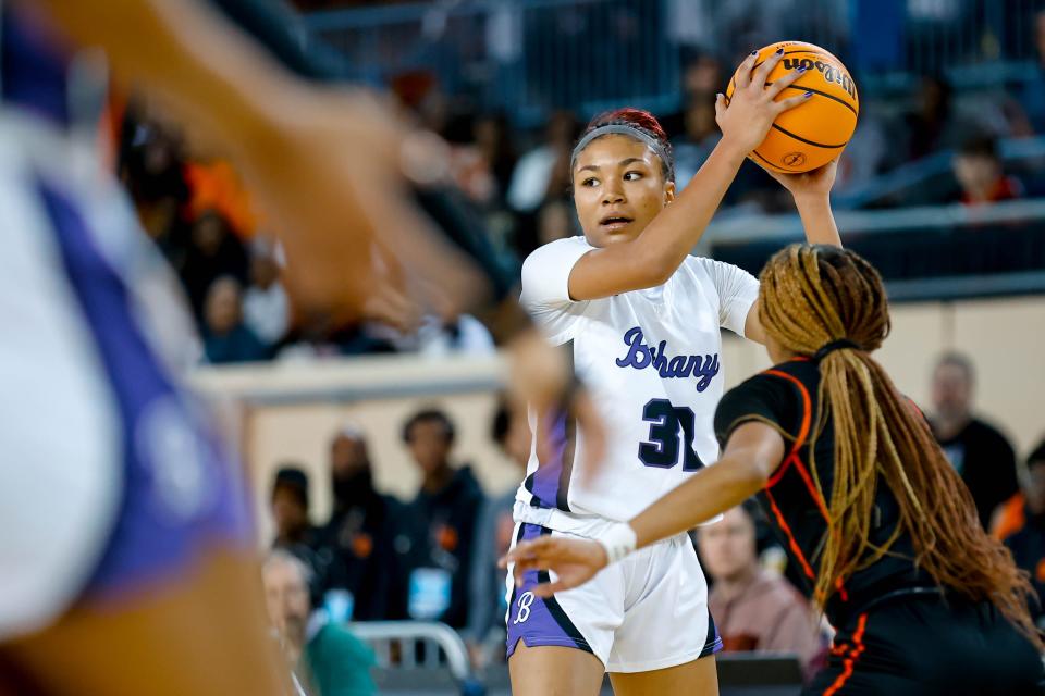 Bethany’s Keziah Lofton (32) looks to pass during the semifinals of the girls state basketball tournament between Bethany and Douglass at the Jim Norick Arena in Oklahoma City, on Friday, March 8, 2024.