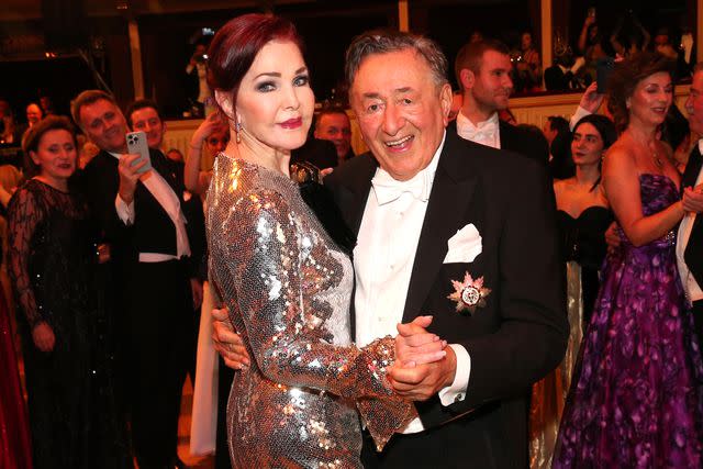 <p>Gisela Schober/Getty</p> Priscilla Presley and Richard Lugner attend 2024's Vienna Opera Ball.