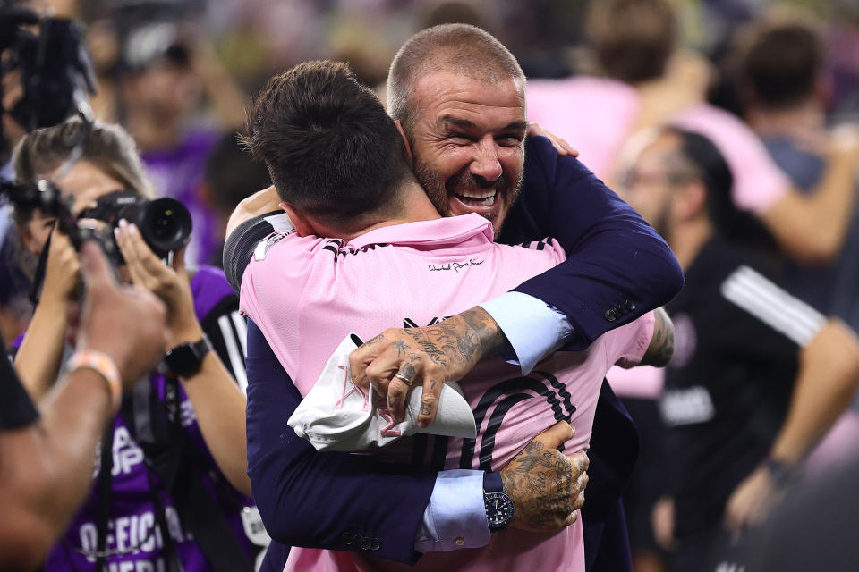 NASHVILLE, TENNESSEE - AUGUST 19: Co-owner David Beckham hugs Lionel Messi #10 of Inter Miami after defeating Nashville SC in penalty shootout to win the Leagues Cup 2023 final match between Inter Miami CF and Nashville SC at GEODIS Park on August 19, 2023 in Nashville, Tennessee. (Photo by Tim Nwachukwu/Getty Images)