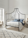 <p>Belying a common design assumption that canopy beds are for traditional settings only, this version from Cox & Cox forgoes heavy curtains or voile covering, leaving an exposed iron frame that stands in wonderful contrast to an all-white bedroom. <br></p><p>Pictured: <a href="https://www.coxandcox.co.uk/luna-canopy-bed-black/" rel="nofollow noopener" target="_blank" data-ylk="slk:Luna Canopy Kingsize Bed at Cox & Cox" class="link ">Luna Canopy Kingsize Bed at Cox & Cox</a></p>