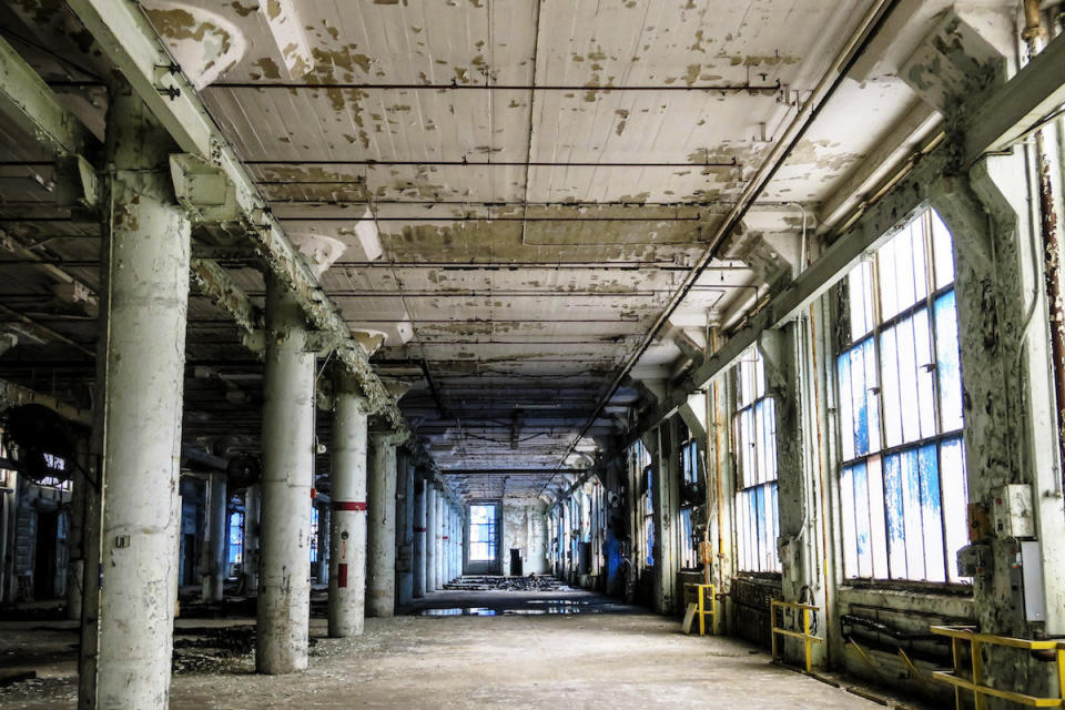 An eerie blue glow as light floods into one of General Electric's disused factories.