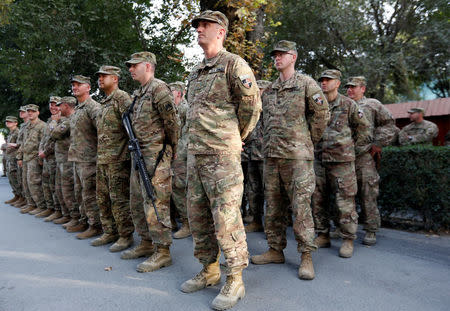 U.S. soldiers take part in a memorial ceremony to commemorate the 16th anniversary of the 9/11 attacks, in Kabul, Afghanistan September 11, 2017. REUTERS/Mohammad Ismail