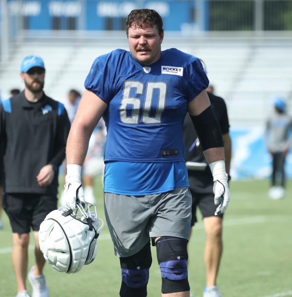 Lions guard Graham Glasgow walks off the field after training camp on Wednesday, July 26, 2023, in Allen Park.