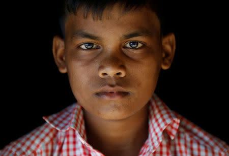 Mohammad Zubair, 14, a Rohingya refugee boy, poses for a picture at Kutupalong refugee camp near Cox's Bazar, Bangladesh, November 12, 2017. REUTERS/Navesh Chitrakar