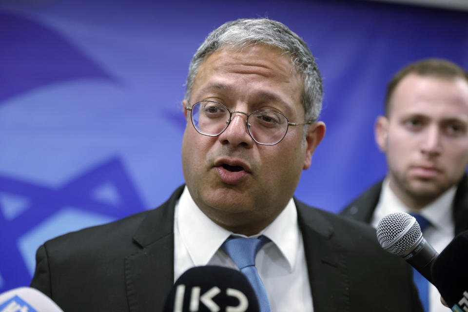 FILE - Israeli Minister of National Security Itamar Ben-Gvir talks to reporters ahead of the weekly cabinet meeting at the prime minister's office in Jerusalem, Sunday, March 19, 2023. When death threats forced Irish pop singer Sinead O’Connor to call off a peace concert in Jerusalem in the summer of 1997, a young man named Itamar Ben-Gvir took credit for the campaign against her. Today, he is Israel’s national security minister. (Abir Sultan/Pool Photo via AP, File)