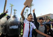 FILE PHOTO: A demonstrator gestures during a protest against COVID-19 vaccine pass in Rabat