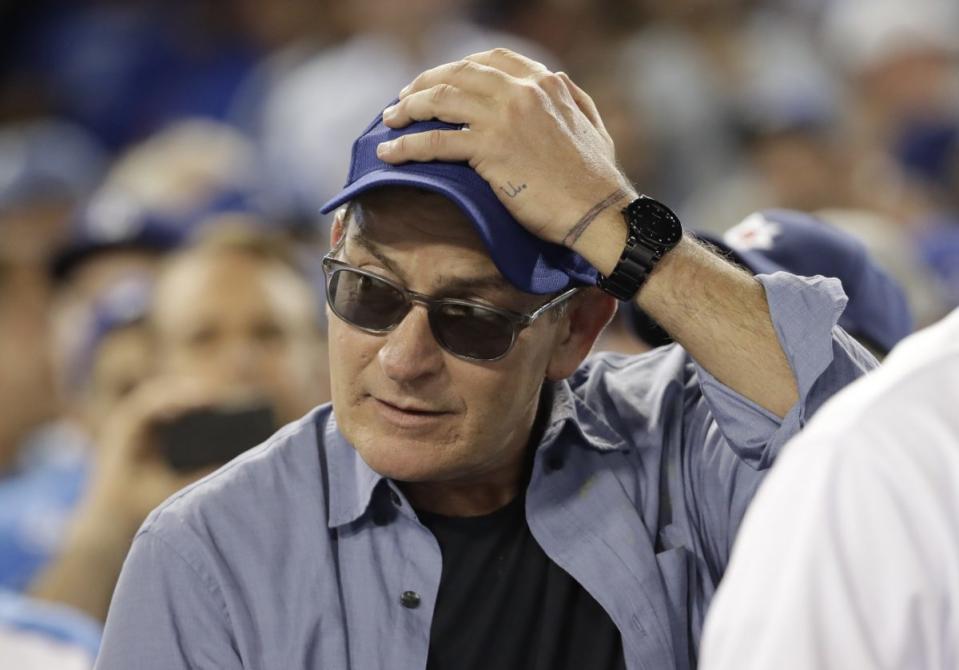 Actor Charlie Sheen reacts during the fifth inning of Game 4 of the National League baseball championship series between the Chicago Cubs and the Los Angeles Dodgers Wednesday, Oct. 19, 2016, in Los Angeles. (AP Photo/David J. Phillip)