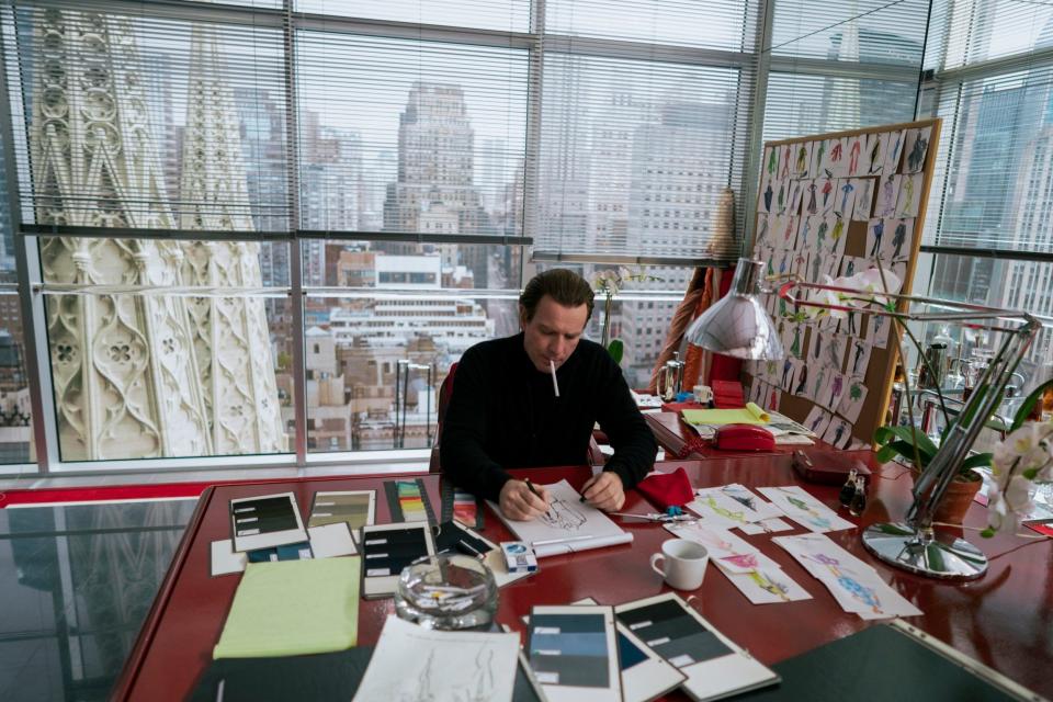 McGregor as Halston at his desk in his all-red Olympic Tower office - ATSUSHI NISHIJIMA/Netflix