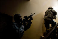 <p>U.S. Army 1st Cavalry Division soldiers of the Charlie Co. 2-12 Cav climb stairs in a building as they look for a sniper that had shot at them minutes before February 8, 2007 in the violent Gazaliyah neighborhood of Baghdad, Iraq. Snipers are a daily problem for US and Iraqi Army soldiers who patrol the neighborhood, which is beset with Sunni-Shia sectarian violence. (Photo by Chris Hondros/Getty Images) </p>