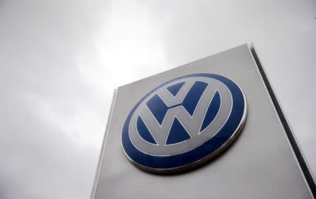 FILE PHOTO: A VW sign is seen outside a Volkswagen dealership in London, Britain November 5, 2015. REUTERS/Suzanne Plunkett/File Photo