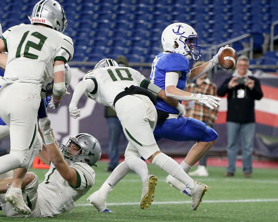 Scituate’s Keegan Sullivan crosses the plane during the two point conversion to give Scituate the 14-13 lead with less than 30 seconds remaining in the game during the Division 4 state title game at Gillette Stadium in Foxboro on Friday, Dec. 3, 2021.