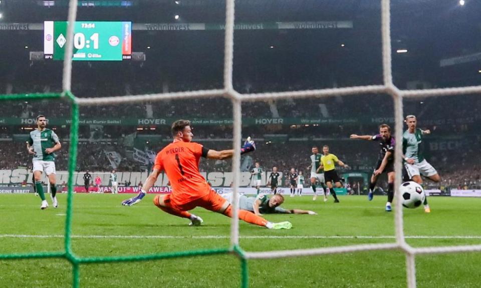 Harry Kane’s deflected shot beats Jiri Pavlenka in the Werder Bremen goal.