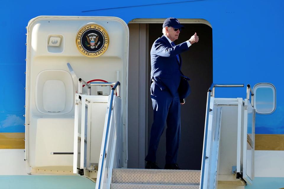 President Joe Biden gives a thumbs up before departing, Wednesday afternoon, Jan. 4, 2023. Biden was in Covington to deliver remarks about the $1.6 billion federal investment in the Brent Spence Bridge. He was joined at the airport by Ohio and Kentucky governors Mike DeWine and Andy Beshear, along with Ohio Sen. Sherrod Brown and Kentucky Sen. Mitch McConnell. Former Sen. Rob Portman was also at the airport. 