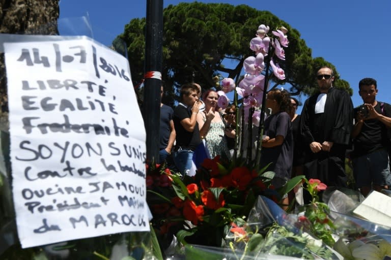 A sign reading "Liberty, equality, fraternity, let us unite against barbarism" is placed at a makeshift memorial in Nice, southern France, on July 15, 2016
