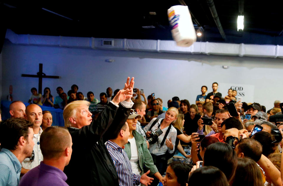 Trump throws rolls of paper towels into a crowd of Puerto Rico residents&nbsp;affected by Hurricane Maria as he visits Calgary Chapel in San Juan on Oct. 3.