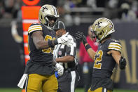 New Orleans Saints tight end Juwan Johnson, left, celebrates with Chris Olave, right, after Johnson caught a touchdown pass against the Los Angeles Rams in the first half of an NFL football game in New Orleans, Sunday, Nov. 20, 2022. (AP Photo/Gerald Herbert)