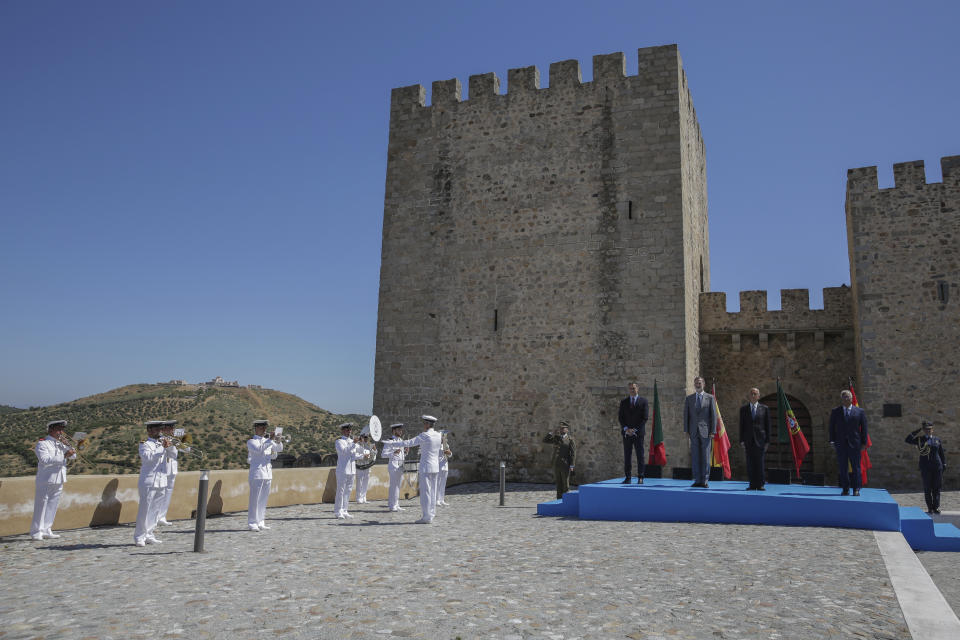 From left to right: Spain's Prime Minister Pedro Sanchez, Spain's King Felipe VI, Portugal's President Marcelo Rebelo de Sousa and Portugal's Prime Minister Antonio Costa stand for national anthems during a ceremony to mark the reopening of the Portugal/Spain border in Elvas, Portugal, Wednesday, July 1, 2020. The border was closed for three and a half months due to the coronavirus pandemic. (AP Photo/Armando Franca)