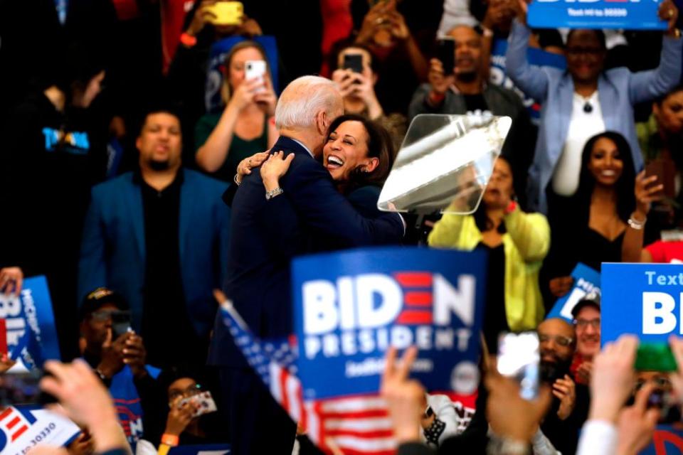 California Senator Kamala Harris (C) hugs Democratic presidential candidate former Vice President Joe Biden after she endorsed him at a campaign rally at Renaissance High School in Detroit, Michigan on March 9, 2020.