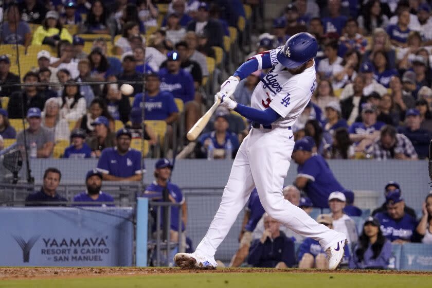 Los Angeles Dodgers' Cody Bellinger hits a three-run home run during the fourth inning.