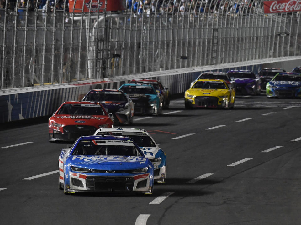 CHARLOTTE, NC - MAY 29: Kyle Larson (#5 Hendrick Motorsports HendrickCars.com Chevrolet) leads Ross Chastain (#1 TrackHouse Racing Advent Health Chevrolet)  during the running of the NASCAR Cup Series Coca-Cola 600 on May 29, 2022, at Charlotte Motor Speedway in Concord, NC.(Photo by Jeffrey Vest/Icon Sportswire via Getty Images)