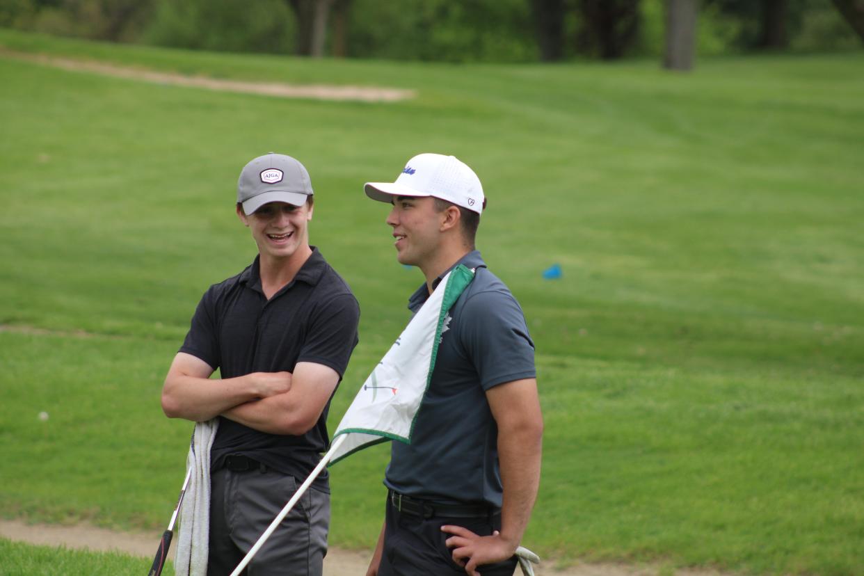 Tecumseh's Grant Simpson, left, and Adrian's Carson Ritz talk during Monday's Lenawee County Boys Golf Invite at The Hills of Lenawee in Adrian.