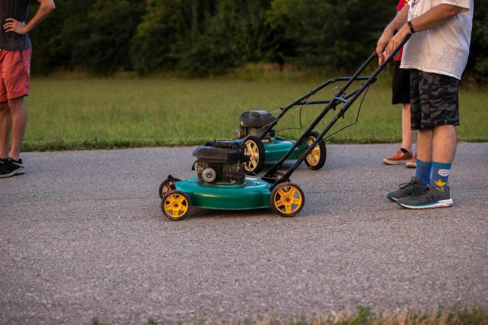 Members of this year’s Wilmore Lawnmower Brigade range in age from 13 to mid-70s. The group practiced its maneuvers on Thursday, June 30, 2022, in Wilmore, Ky.