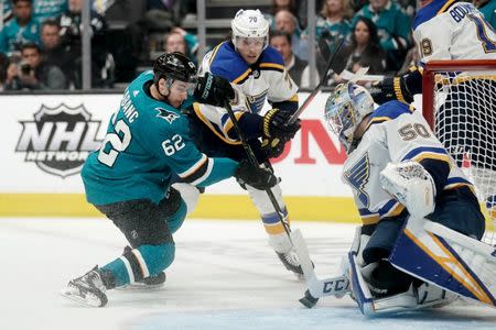 May 19, 2019; San Jose, CA, USA; St. Louis Blues center Oskar Sundqvist (70) and goaltender Jordan Binnington (50) defend against San Jose Sharks right wing Kevin Labanc (62) during the third period in Game 5 of the Western Conference Final of the 2019 Stanley Cup Playoffs at SAP Center at San Jose. Mandatory Credit: Stan Szeto-USA TODAY Sports