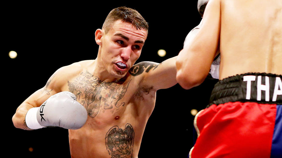 Seen here, Lee Noble gets ready to throw a punch during a boxing match.