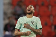 Brazil's Neymar smiles during a training session at the Grand Hamad stadium in Doha, Qatar, Sunday, Dec. 4, 2022. Brazil will face South Korea in a World Cup round of 16 soccer match on Dec. 5. (AP Photo/Andre Penner)