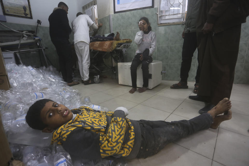 Palestinians wounded in Israeli bombardment receive treatment in a hospital t in Rafah, Gaza Strip, Monday, Feb. 5, 2024. (AP Photo/Hatem Ali)