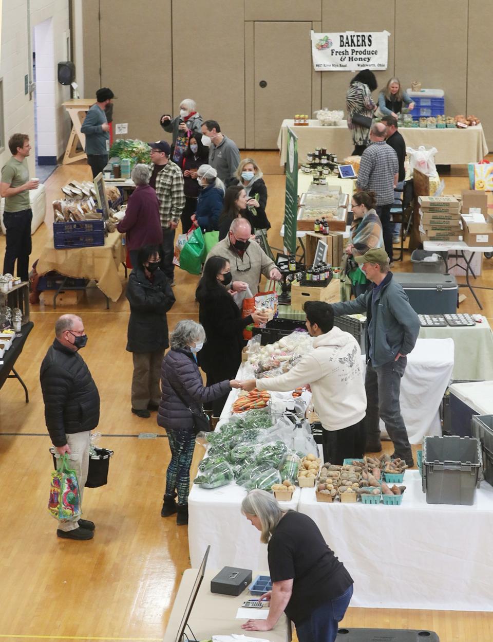 Shoppers look over the goods available at the Countryside Winter Farmers' Market at Old Trail School in Bath. The winter market will be open in 9 a.m. to noon March 19, April 2, April 16 and April 30.