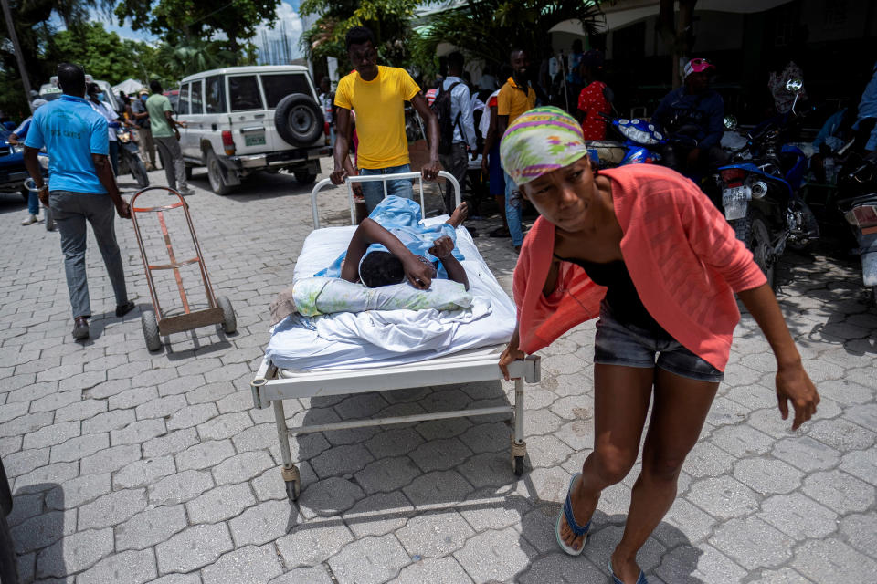 A woman injured in the earthquake is transported to a hospital in Les Cayes on Aug. 16.<span class="copyright">Ricardo Arduengo—Reuters</span>