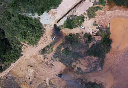 An aerial view shows machines being destroyed during an operation conducted by the Brazilian Institute for the Environment and Renewable Natural Resources (IBAMA) and Federal Police at an illegal gold mine near the city of Altamira