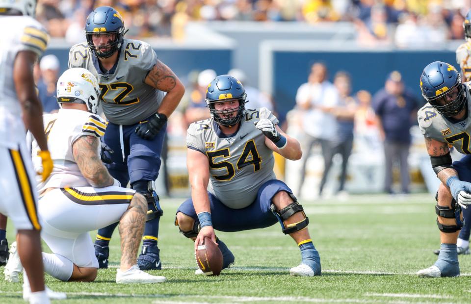West Virginia Mountaineers offensive lineman Zach Frazier (54) during the first quarter against the Towson Tigers at Mountaineer Field at Milan Puskar Stadium.