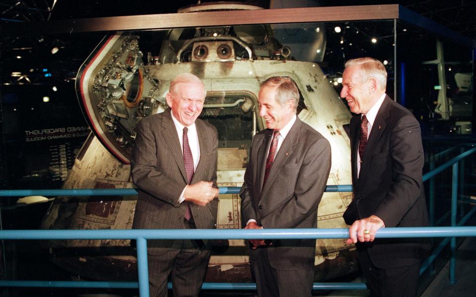 Anders, centre, with crew-mates Frank Borman, left, and James Lovell Jr celebrate Apollo 8's 25th anniversary in 1993