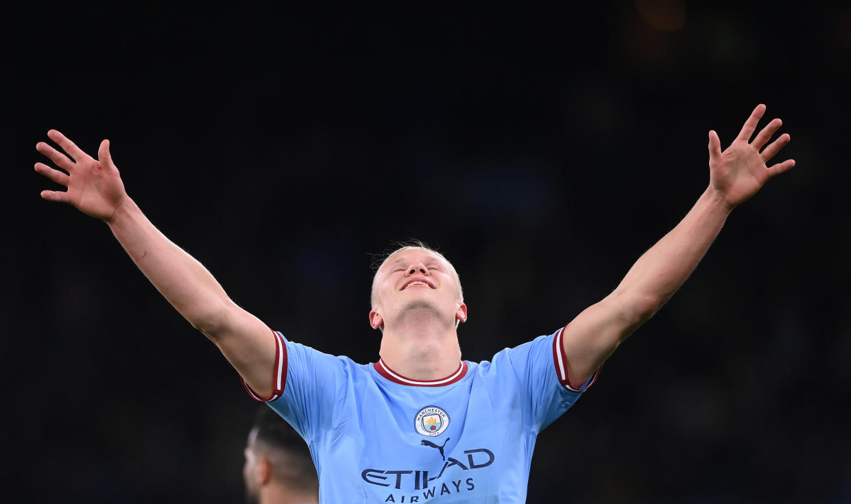 Manchester City striker Erling Haaland celebrates after breaking the English Premier League single-season scoring record. 
