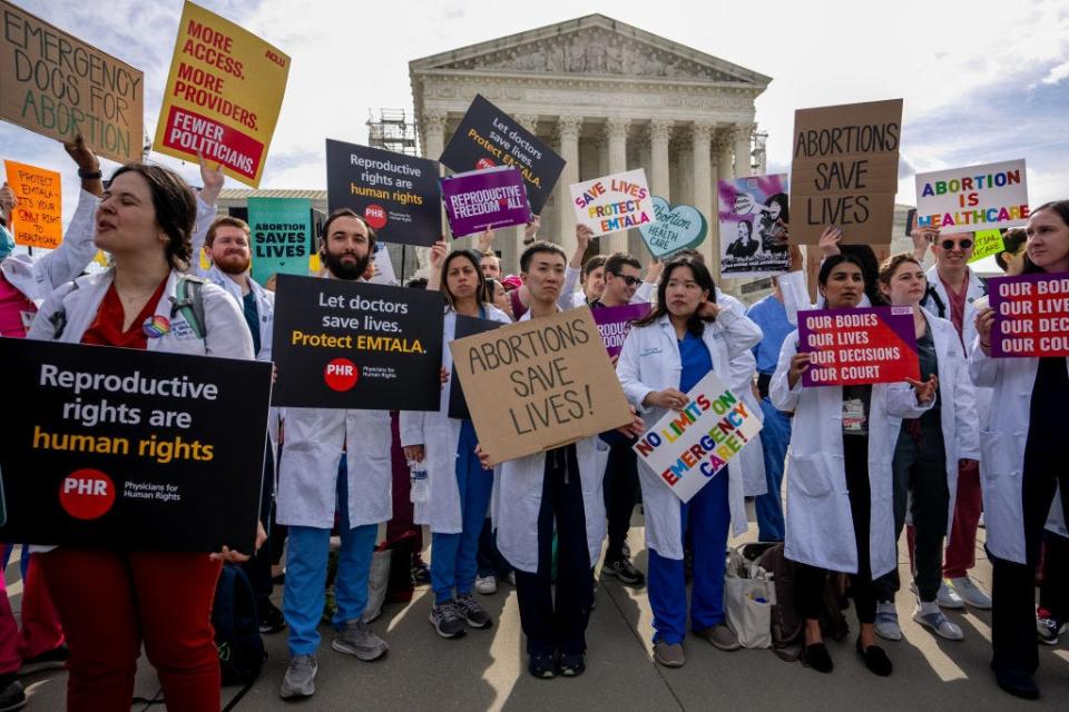 Doctors advocate against an Idaho abortion ban outside of the Supreme Court