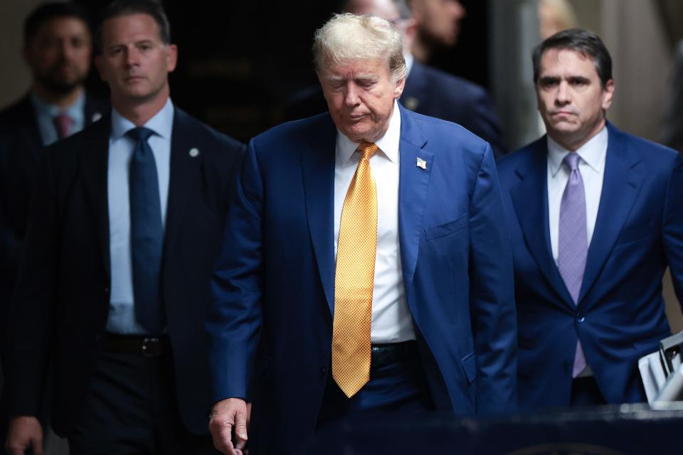 NEW YORK, NEW YORK - MAY 07: Former U.S. President Donald Trump walks to speak to the press at his trial for allegedly covering up hush money payments at Manhattan Criminal Court on May 7, 2024 in New York City. Trump has been charged with 34 counts of falsifying business records, which prosecutors say was an effort to hide a potential sex scandal, both before and after the 2016 presidential election. Trump is the first former U.S. president to face trial on criminal charges.