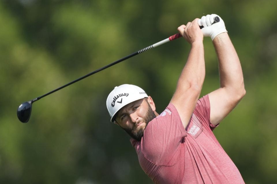 Jon Rahm from Spain plays his second shot on the second hole hole during the final round of the DP World Tour Championship golf tournament, in Dubai, United Arab Emirates, Sunday, Nov. 19, 2023. (AP Photo/Kamran Jebreili)