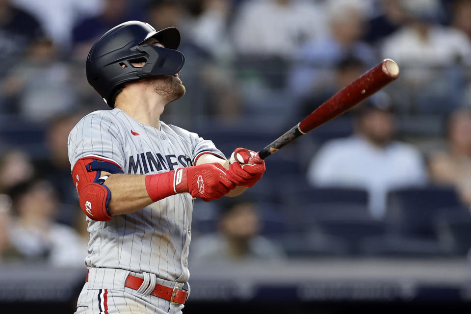 Minnesota Twins' Edouard Julien watches his home run against the New York Yankees during the first inning of a baseball game Thursday, April 13, 2023, in New York. (AP Photo/Adam Hunger)