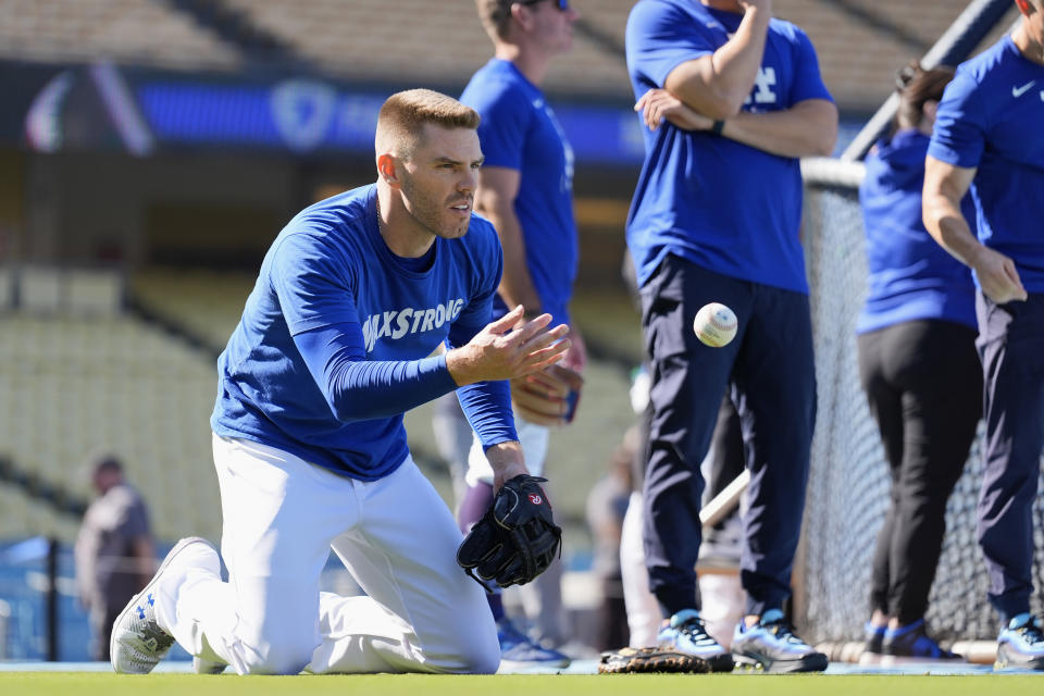 Los Angeles Dodgers' Freddie Freeman warms up before Game 1 of baseball's NL Division Series against the San Diego Padres, Saturday, Oct. 5, 2024, in Los Angeles. (AP Photo/Ashley Landis)