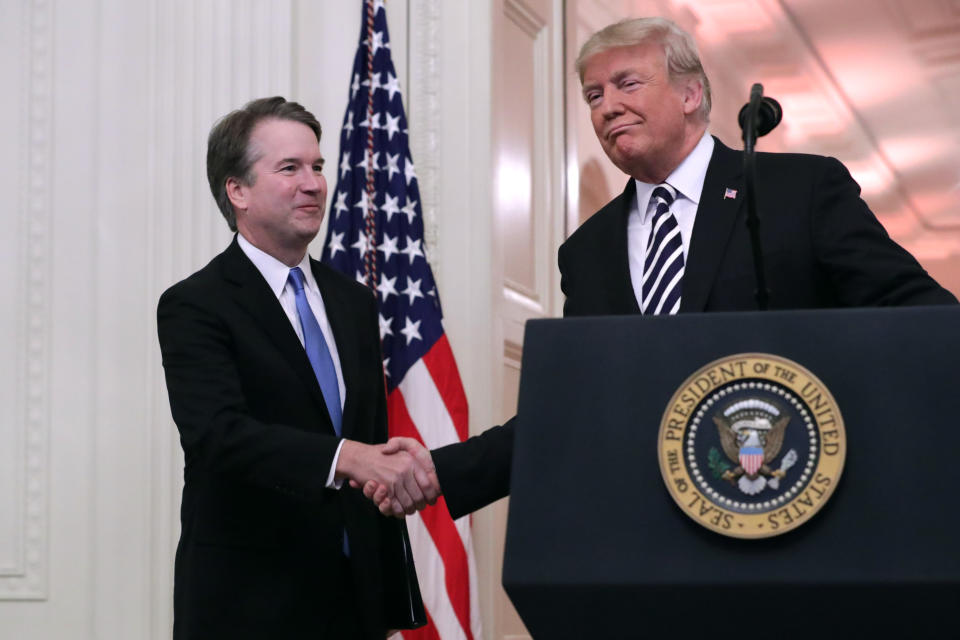 U.S. Supreme Court Justice Brett Kavanaugh (L) shakes hands with President Donald Trump during Kavanaugh's ceremonial swearing in in the East Room of the White House October 08, 2018 in Washington, DC. Kavanaugh was confirmed in the Senate 50-48 after a contentious process that included several women accusing Kavanaugh of sexual assault. Kavanaugh has denied the allegations. (Photo: Chip Somodevilla/Getty Images)