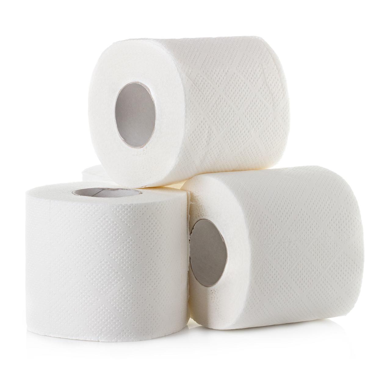 Three rolls of toilet paper, stacked with one on top, looks like a triangle, on a white background