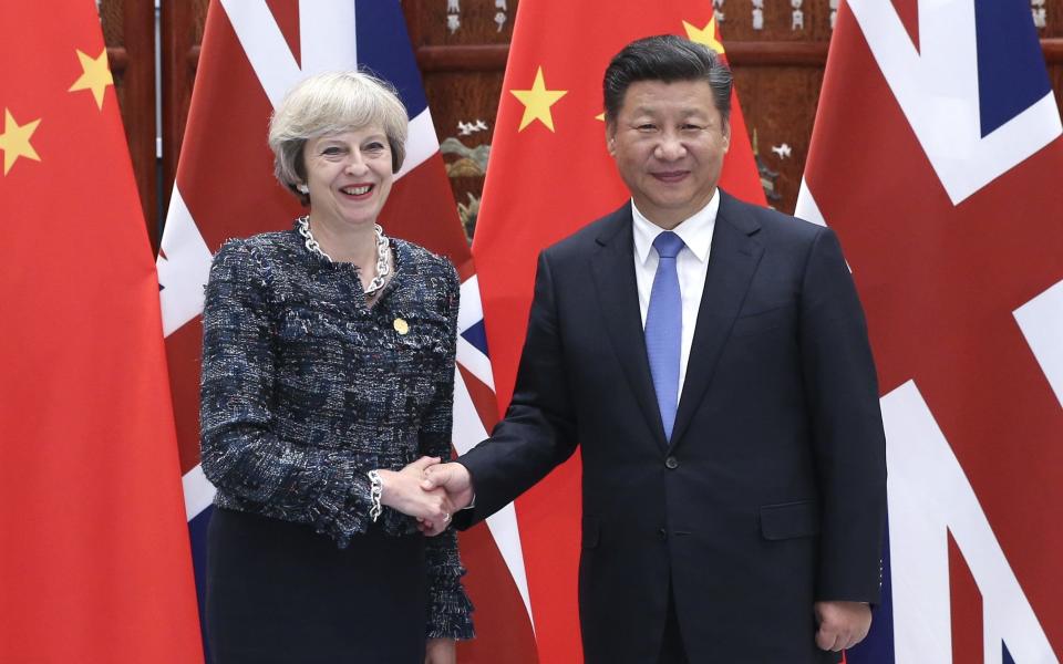 Theresa May and Xi Jinping - Credit: Xinhua / Barcroft Images