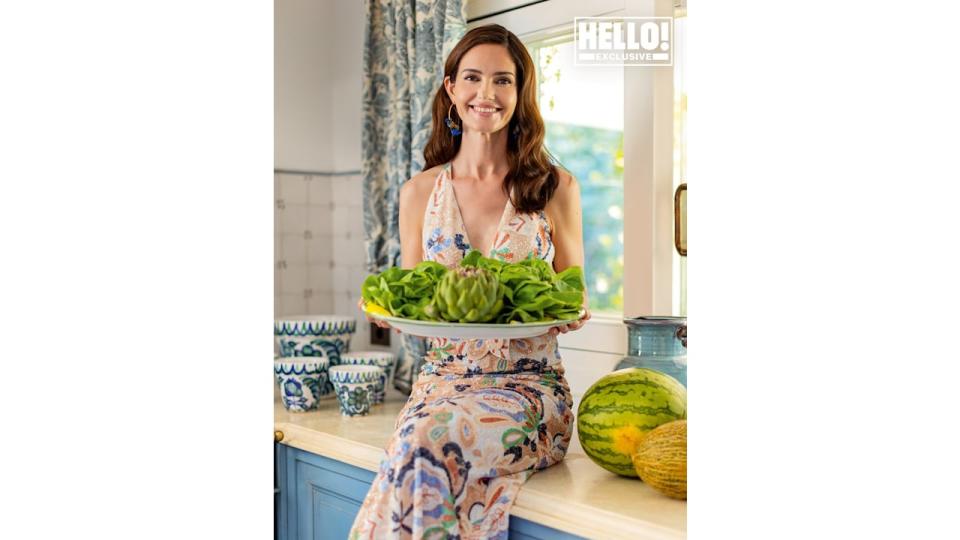 Veronica Schmidt posing with salad in Marbella home kitchen