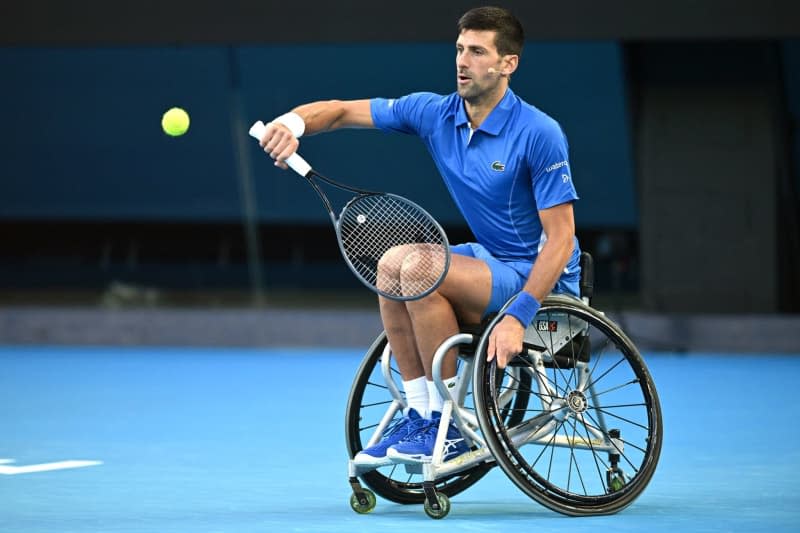 Serbian tennis player Novak Djokovic in action using a tennis wheelchair during a Night with Novak and Friends’ charity tennis matches at Rod Laver Arena. Joel Carrett/AAP/dpa