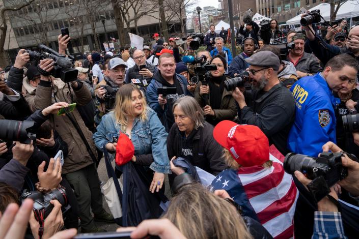 Protesters clash outside the Manhattan Criminal Courthouse in New York City on Tuesday.