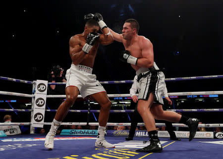 Boxing - Anthony Joshua vs Joseph Parker - World Heavyweight Title Unification Fight - Principality Stadium, Cardiff, Britain - March 31, 2018 Anthony Joshua in action with Joseph Parker Action Images via Reuters/Andrew Couldridge